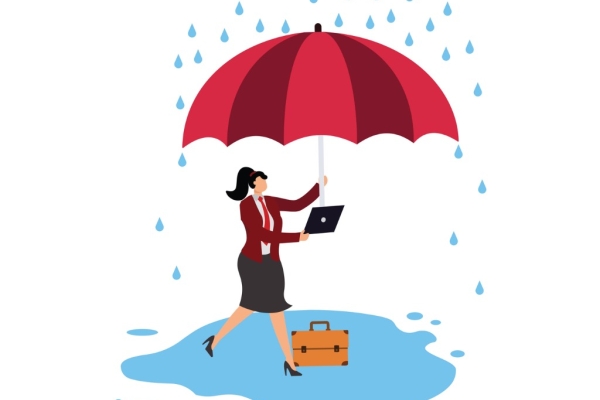 Illustration of a light skinned woman with a black ponytail and wearing a business suit. She shelters under a large umbrella that she holds in her left hand. In her right hand she holds a laptop. while also holding a laptop. She and her briefcase are