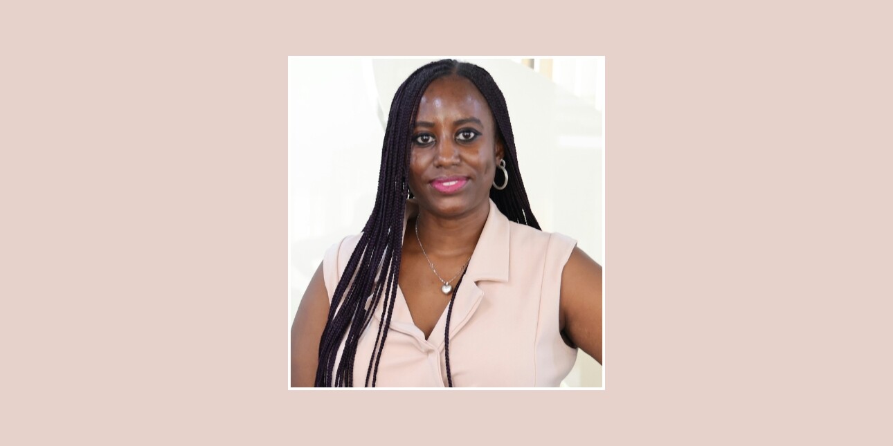 A square colour portrait of Linda Nabirye at the centre of a pastel pink background. Linda is a Black woman with long hair who wears a pastel pink top.