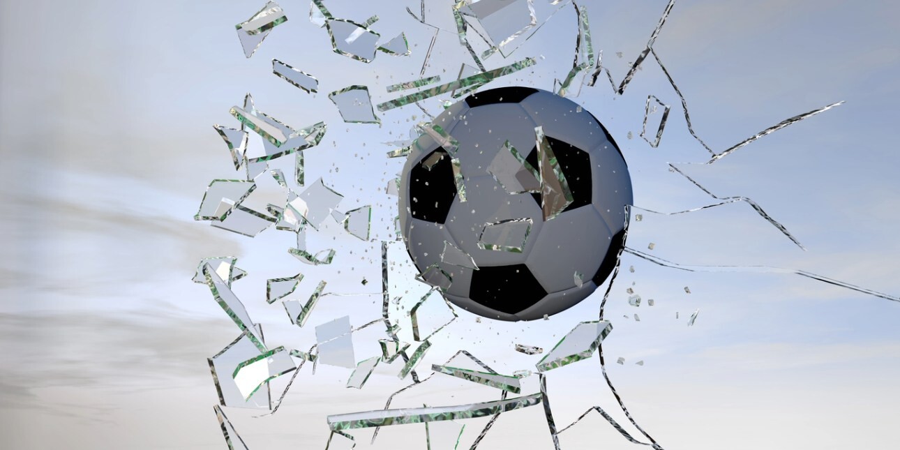 A digitised image of a football shattering glass