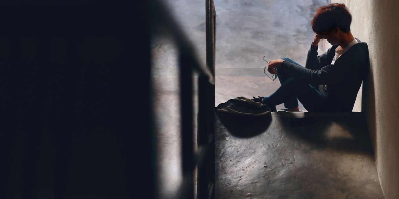 person sitting in hallway