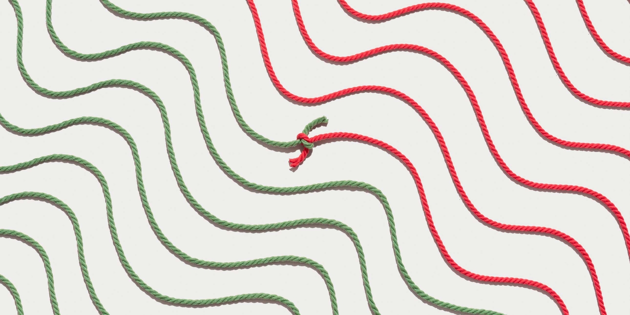 Red and Green Colored Wavy Ropes Tied and Connected Together
