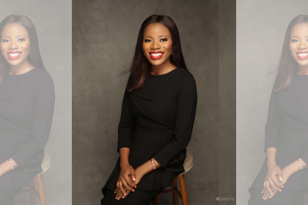 A tryptic portrait of Adedoyin Jaiyesimi sat facing the camera. Adedoyin is a Black woman with long, dark hair wearing dark clothing. The background is dark grey.