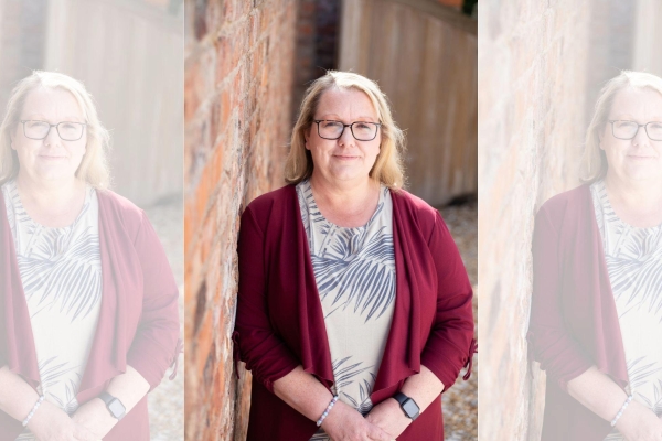 A triptych of Amanda Coleman, a white woman with blond hair and glasses is wearing a light top and a red cardigan on top