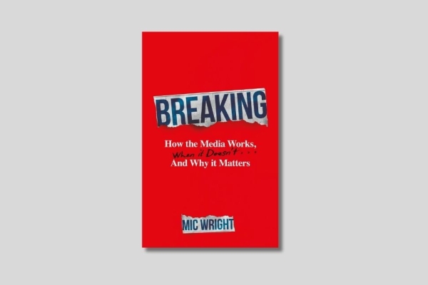 The plain red book cover with the title in various type forms including the word Breaking written as a tabloid font on a ripped newspaper