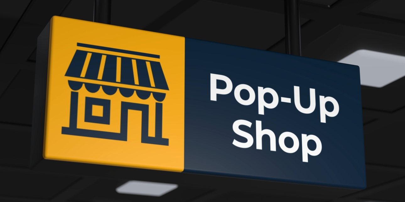 An illustration of a blue shop sign saying 'Pop-Up Shop' next to a yellow childish drawing of a shop