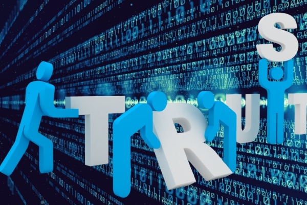 A computer generated illustration of blue 'people' lining up three dimensional white letters to spell TRUST. The background is an array of digital code.