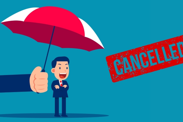 An illustration of a suited man shouting while being protect by a giant umbrella. The word cancelled is stamped in red alongside.