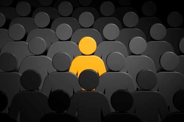 A digital image of a series of a golden stick figure surrounded by a group of dark-grey stick figures.