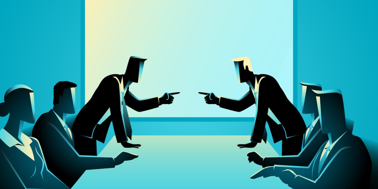 Illustration of two businesspeople stood pointing at each other in front of four colleagues sat around a board table