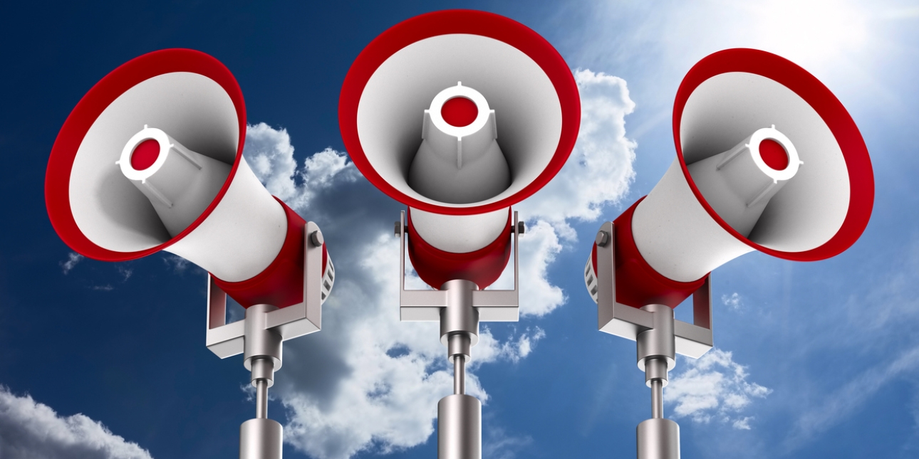 A computer generated image of three red and white tannoys on posts against a dark blue sky with some grey clouds