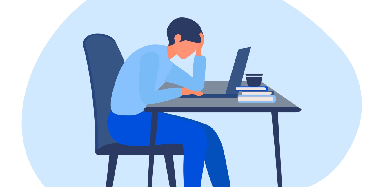 Illustration of a person wearing two-tone blue clothing sat hunched over a laptop and holding their head with one hand