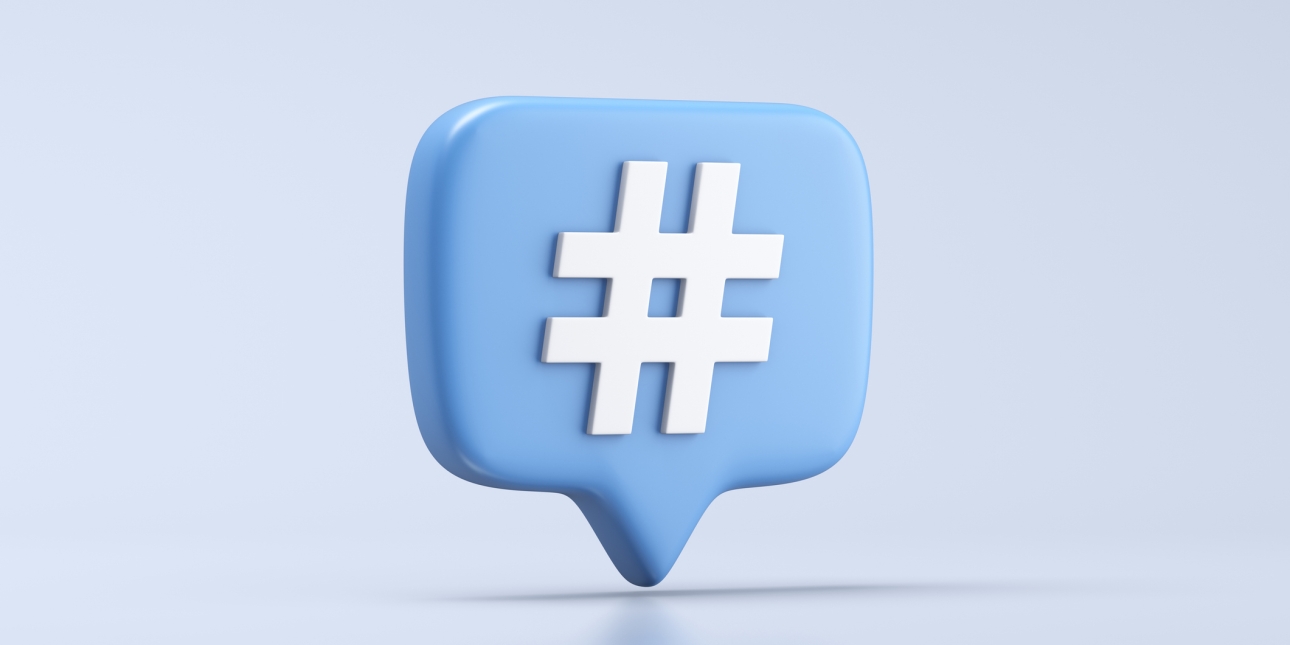 A computer generated image of a light blue, three-dimensional speech bubble featuring a white hashtag symbol in the centre