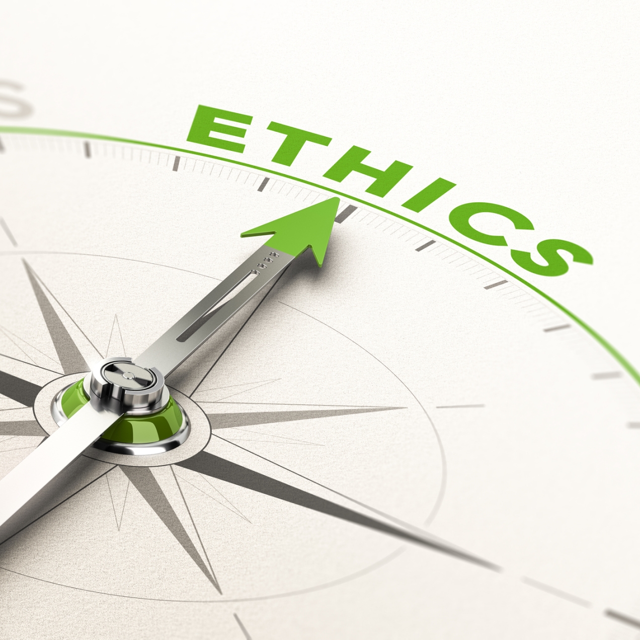 A silver compass needle pointing at the word ethics. The tip of the needle and the word are in green.