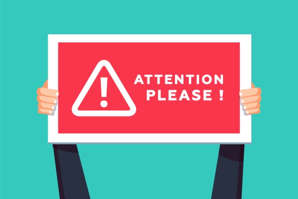 Illustration of two hands holding a rectangular sign which reads attention please. A triangle with an exclamation mark sits within the sign.