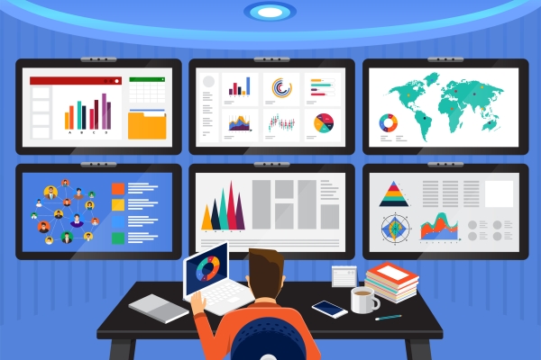 Illustration of six screens showing brightly coloured graphs, social media connections and maps. A person, seen from behind, is sat at a desk in front of the screens with books, laptop and coffee