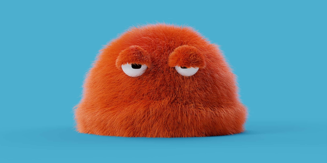 A rounded monster character constructed from brown bristles, with two despondent cartoon-like eyes. The background is bright blue.