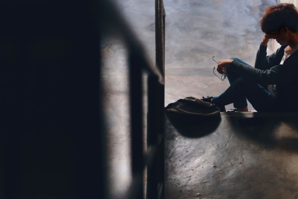 person sitting in hallway