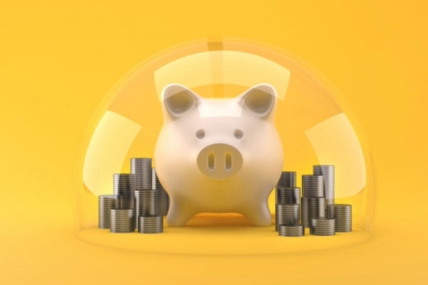 A digital illustration on a yellow background a pink piggy back surrounded by stacks of coins under a transparent dome