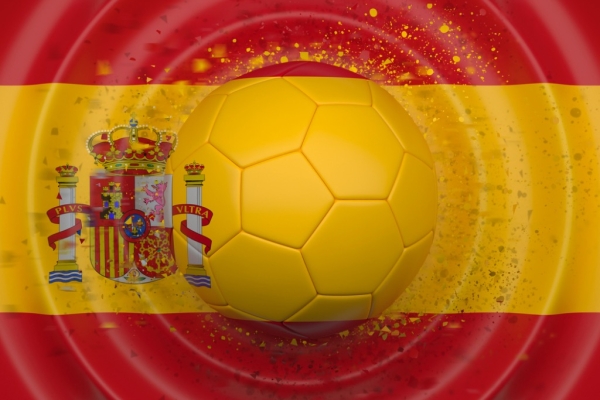 The transparent football in the centre of the Spanish flag. There are circular waves around the football.