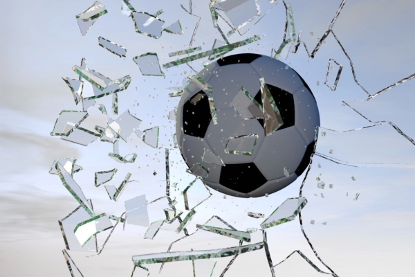 A digitised image of a football shattering glass
