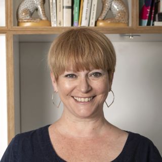 Sam Williams looking straight to camera and smiling.