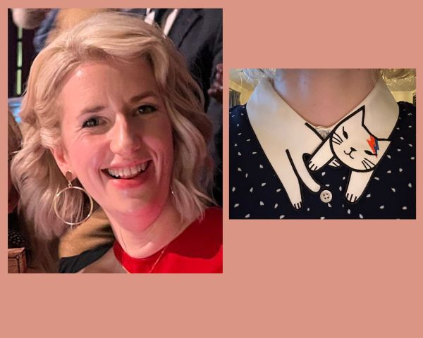 Composite of two images. On the left is a head and shoulders portrait of Catherine Ritchie, a white woman with wavy blonde hair and hooped earrings. She is looking at the camera and smiling. The photo on the right shows a collar on a white flecked black dress which is shaped like a white cat. The cat has a face and two paws at one end, and two more paws and a tail at the other. The cat has make up on like David Bowie's Ziggy Stardust character - a lightning bolt on the forehead in orange and blue.