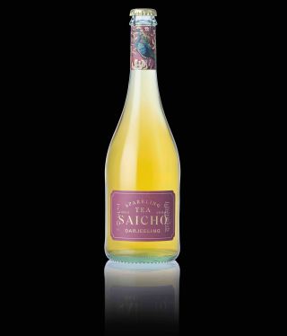 A capped glass bottle, full of yellow tea. It is decorated with a purple label which reads sparkling tea Saicho