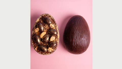 Two halves of a chocolate easter egg, the left facing up with a filled centre and the right facing down