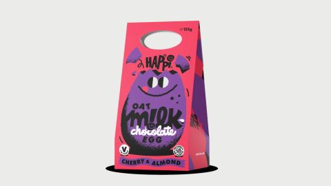 A red box with a purple illustration of an Easter egg with eyes and smile and writing that says HAPPI oat milk chocolate egg